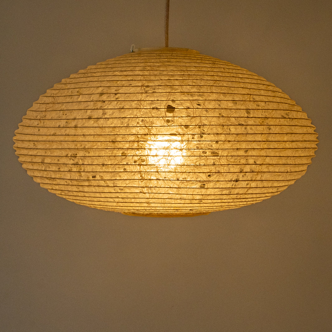 46cm diameter oval hemp paper lampshade, handmade in Japan, side view, illuminated