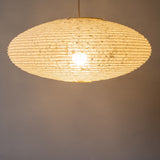 Handmade Large Japanese Paper Lampshade, 60cm diameter, Hemp or Asaraku paper, bulb just visible through the paper, side view, illuminated
