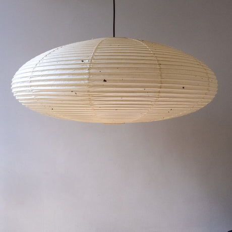 An elliptical 90cm Japanese paper lampshade, made from warm organic natural kozo washi paper