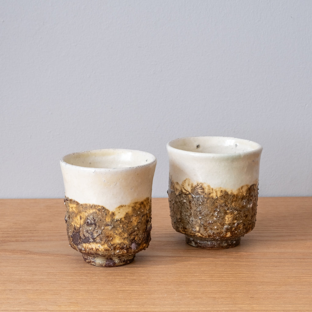 Sake cups with a tactile layer of rough clay, handmade in Japan