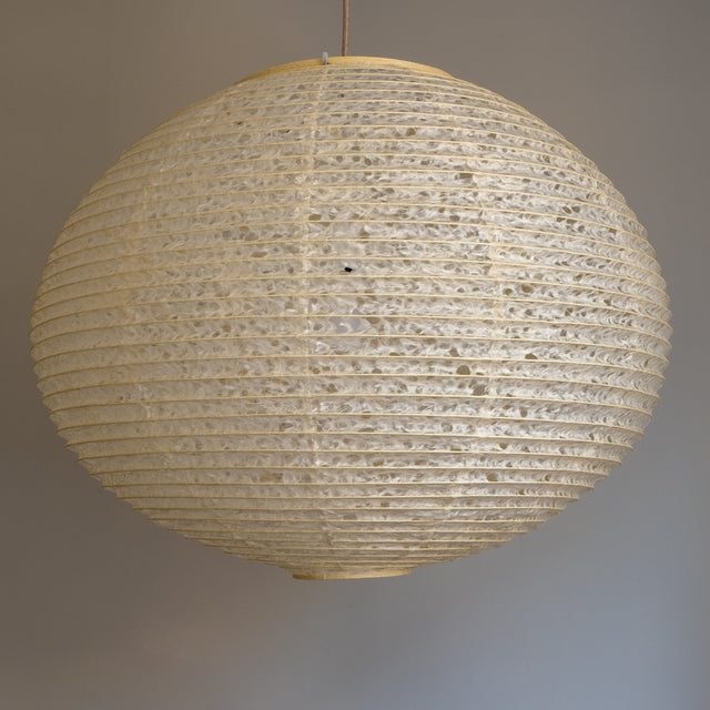 A large 71cm maru (round) paper lampshade, handmade from Japanese hemp washi paper in the asaraku style, where small holes are left in the paper