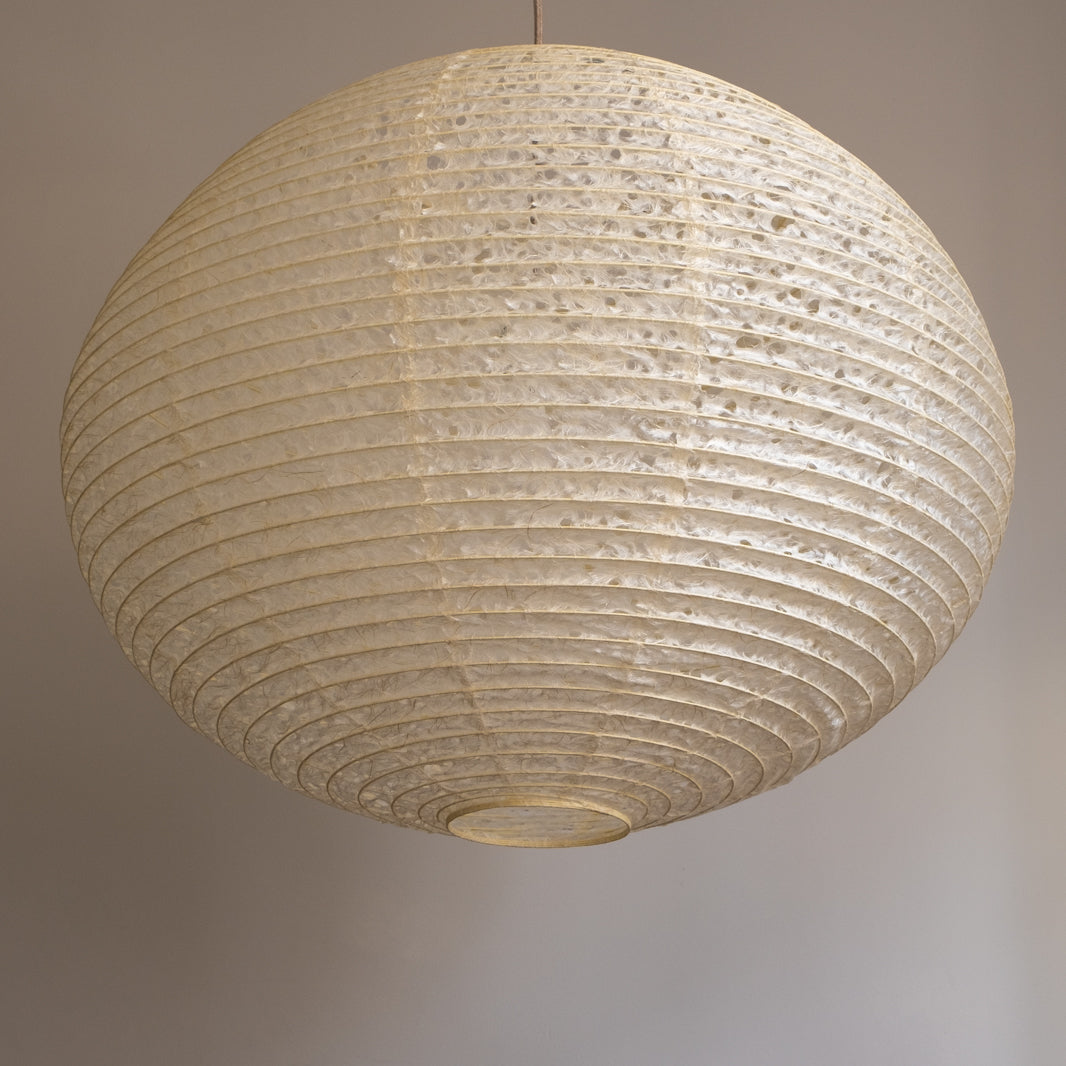 A large 71cm maru (round) paper lampshade, handmade from Japanese hemp washi paper in the asaraku style, where small holes are left in the paper, under view