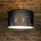 Japanese indigo patterned lampshade on brick wall