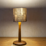 Petite desk shade (6" Diameter), in a subtle Japanese indigo stripe (Lit)